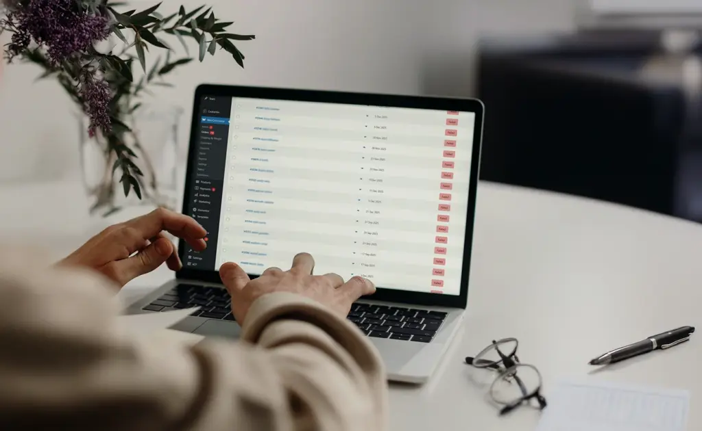 User working on the backend of a website using a laptop.